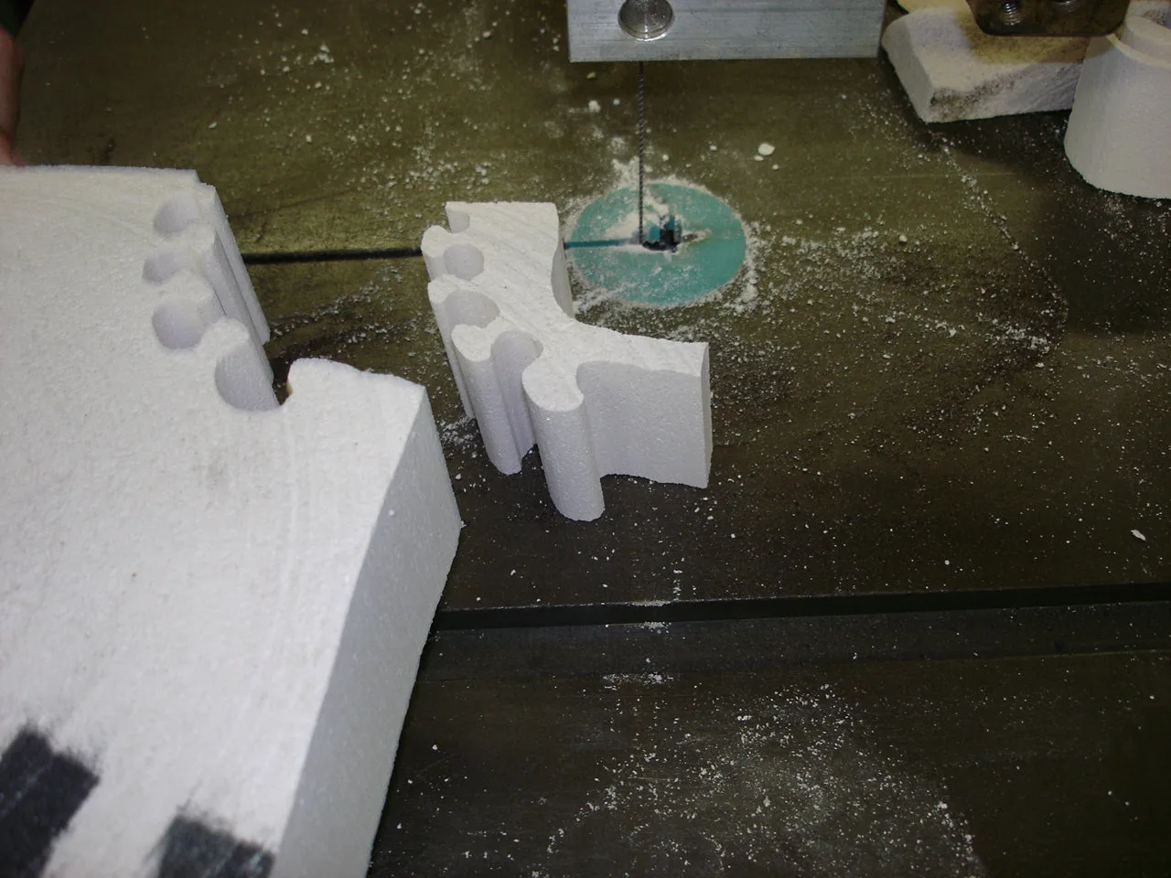 EPS foam block being sliced on a bandsaw fitted with a Spyral blade